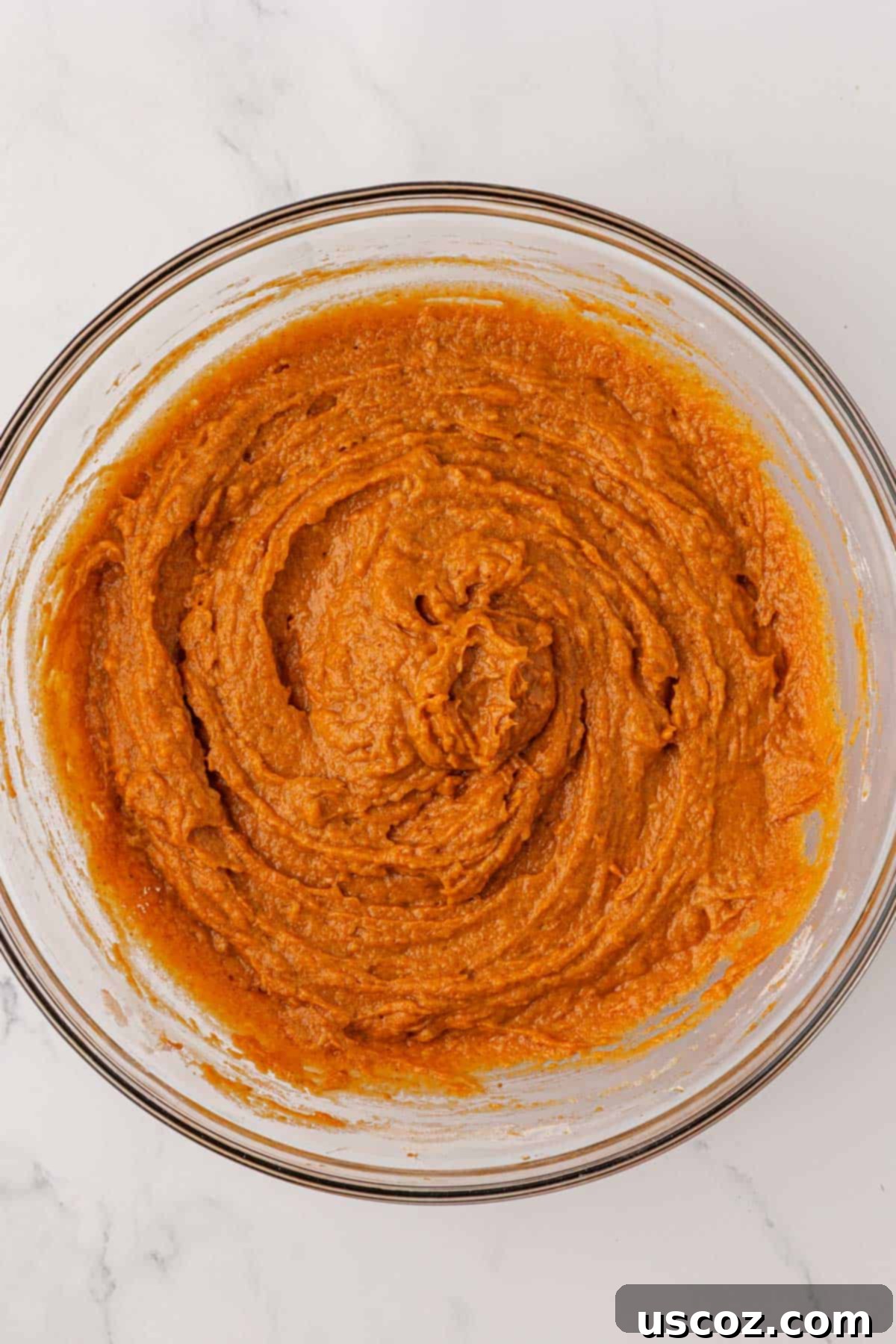 Pumpkin snack cake batter perfectly mixed together in a bowl