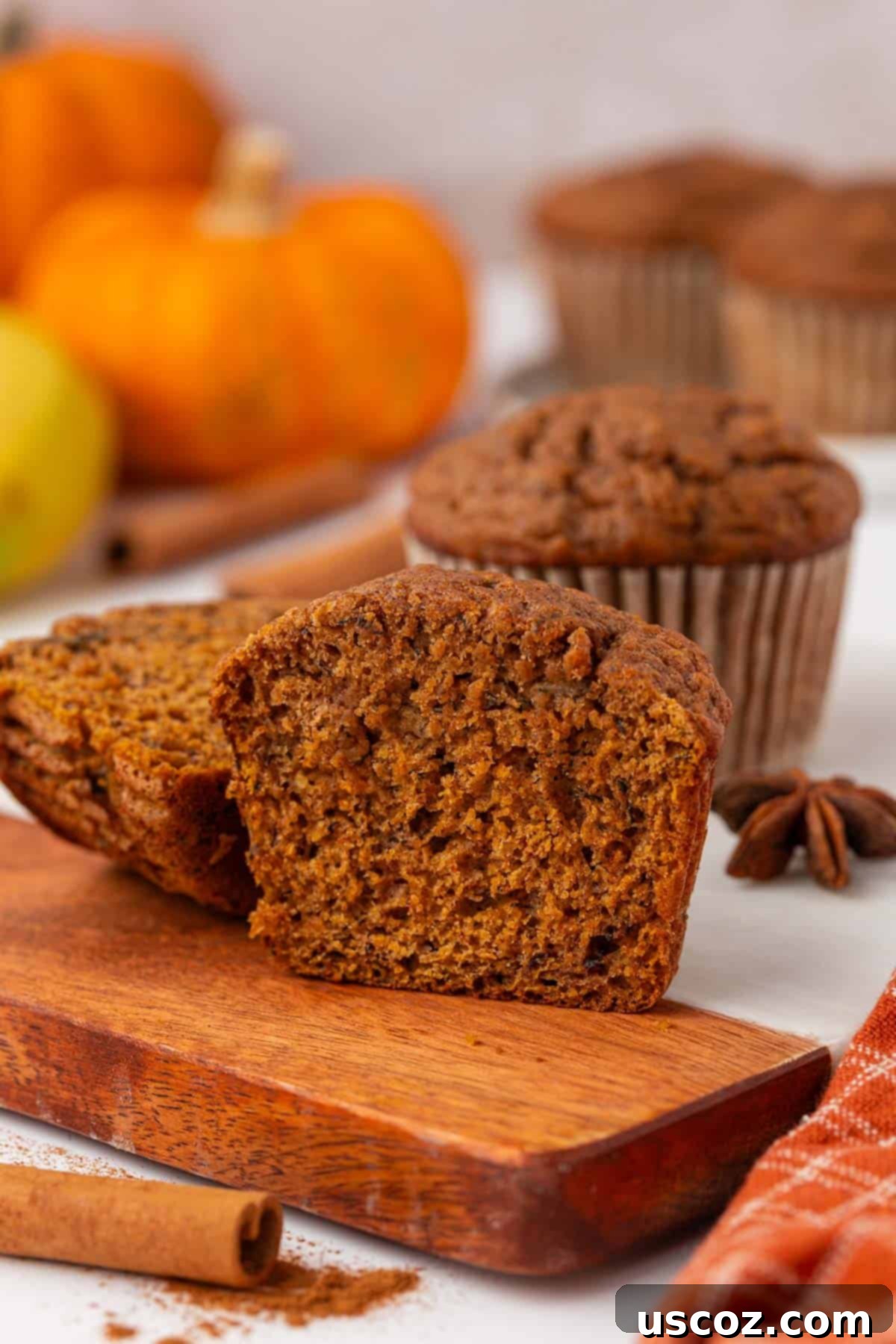 Golden Pumpkin Banana Muffins 16 freshly baked pumpkin banana muffins cooling on a wire rack