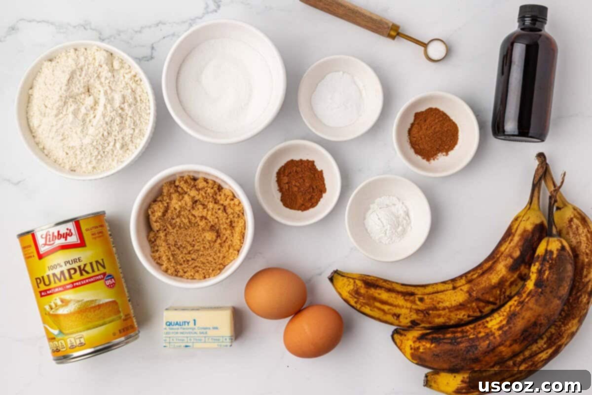 Golden Pumpkin Banana Muffins 4 ingredients needed to make pumpkin banana muffins laid out on a table