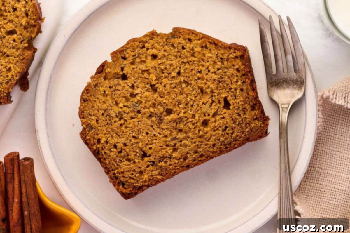 A slice of pumpkin banana bread served on a plate, ready to be enjoyed