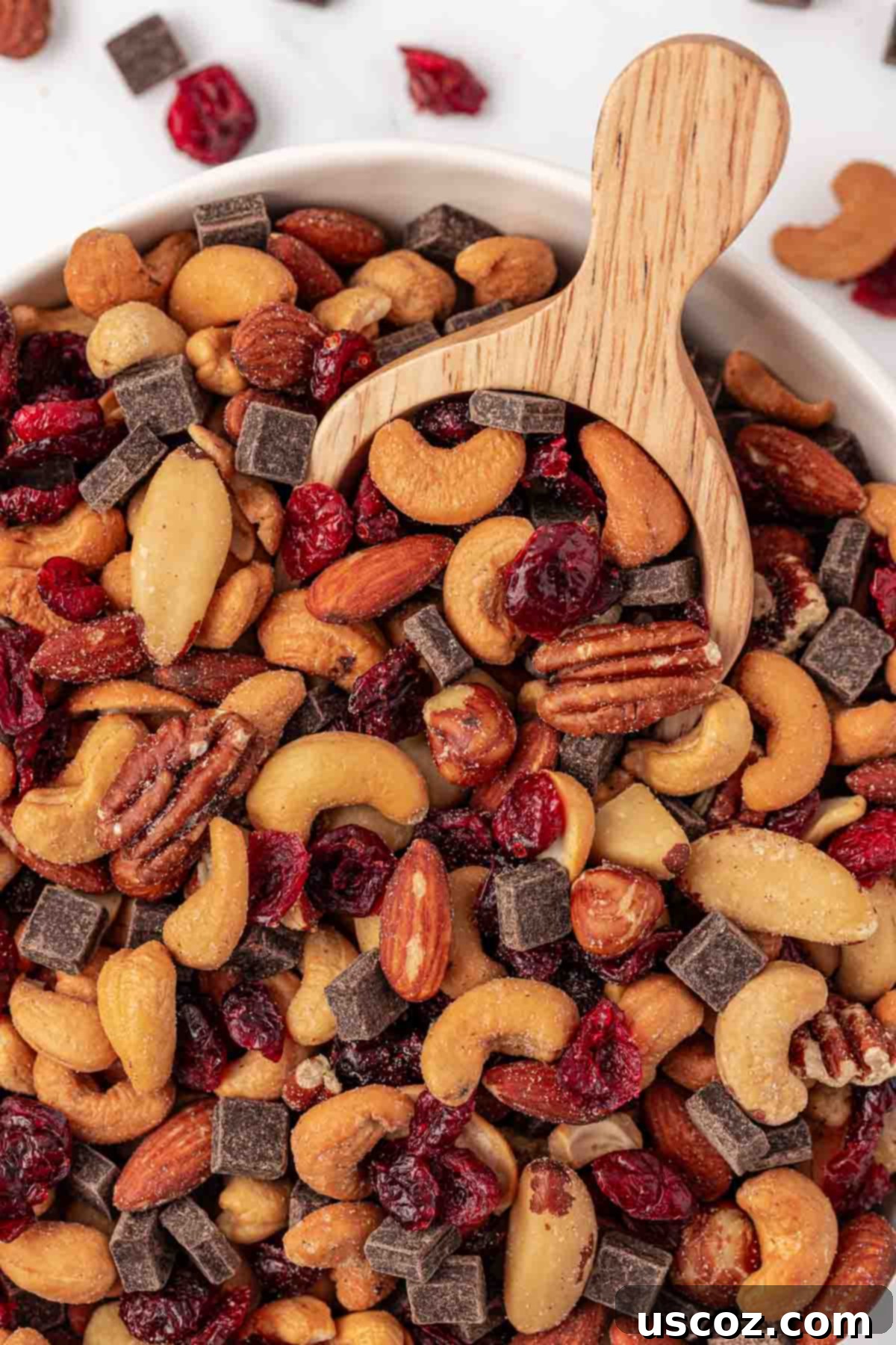 The Ultimate Guide to Crafting Your Own Trail Mix 8 Trail mix with a scoop